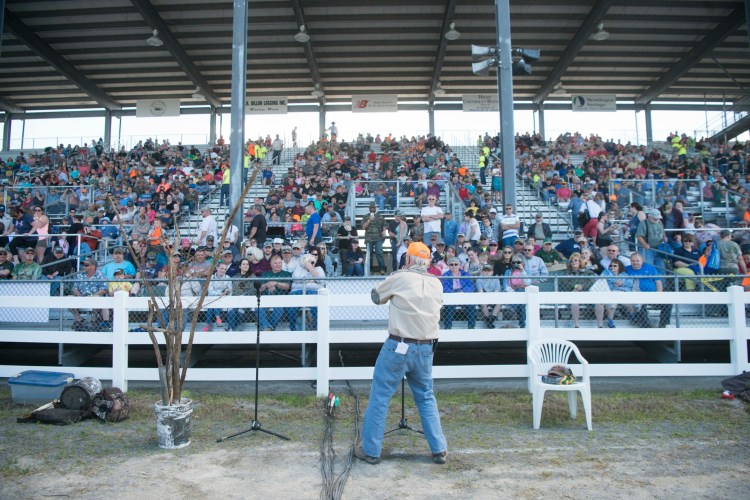 Robert Lambert welcomes the crowd on June 9, 2018, to the moose call demonstration at the Skowhegan Moose Fest at the Skowhegan Fairgrounds. A Guinness World Record was set by the 1,054 people who simultaneously made a moose call.