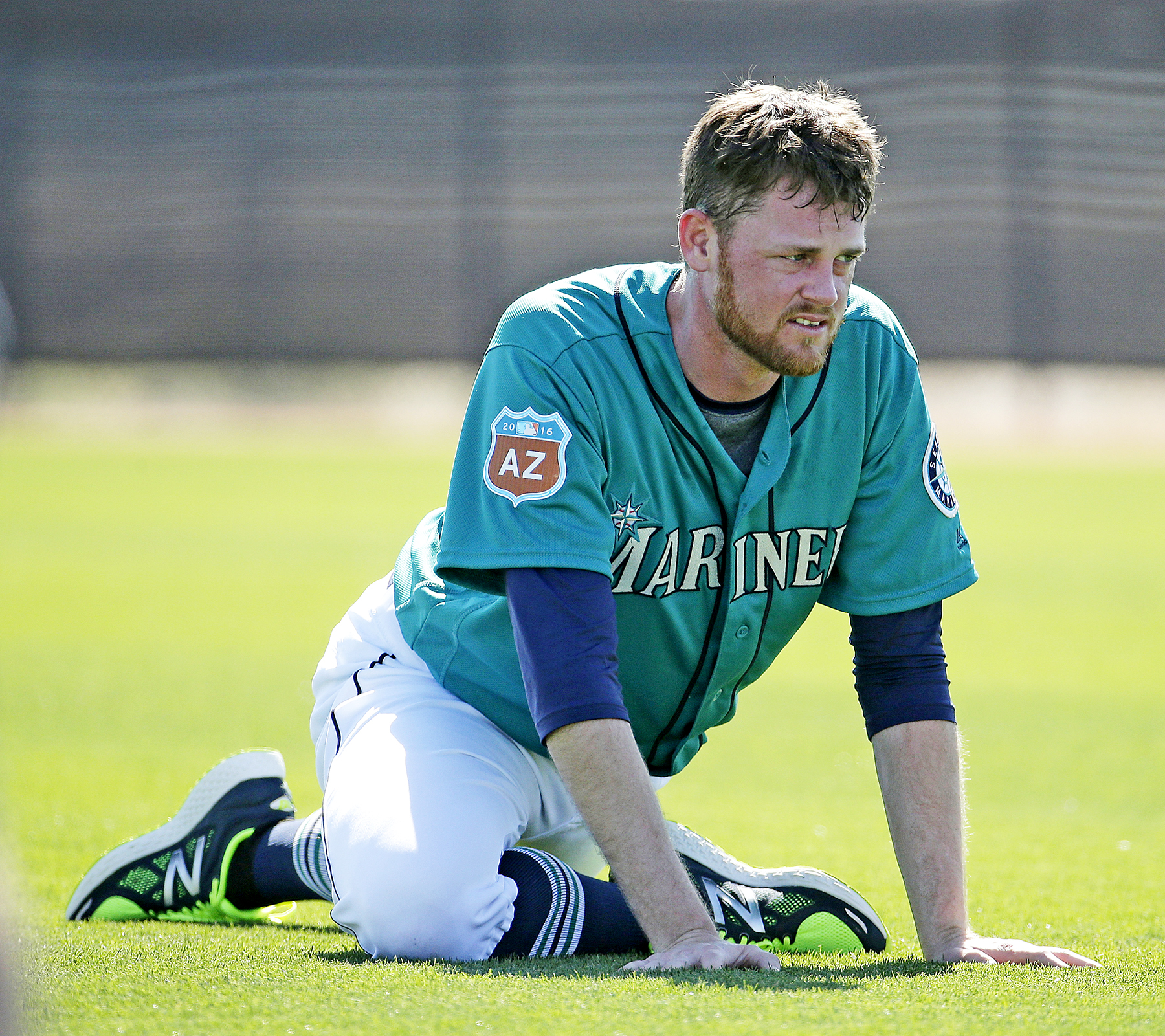 Seattle Mariners' Charlie Furbush, left, points out new socks as
