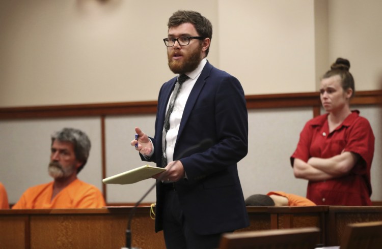 Attorney Taylor Sampson addresses the judge while defending indigent citizens at Cumberland County Superior Court in Portland in this 2017 Associated Press photo. Maine is the only state in the nation without a public defender's office.