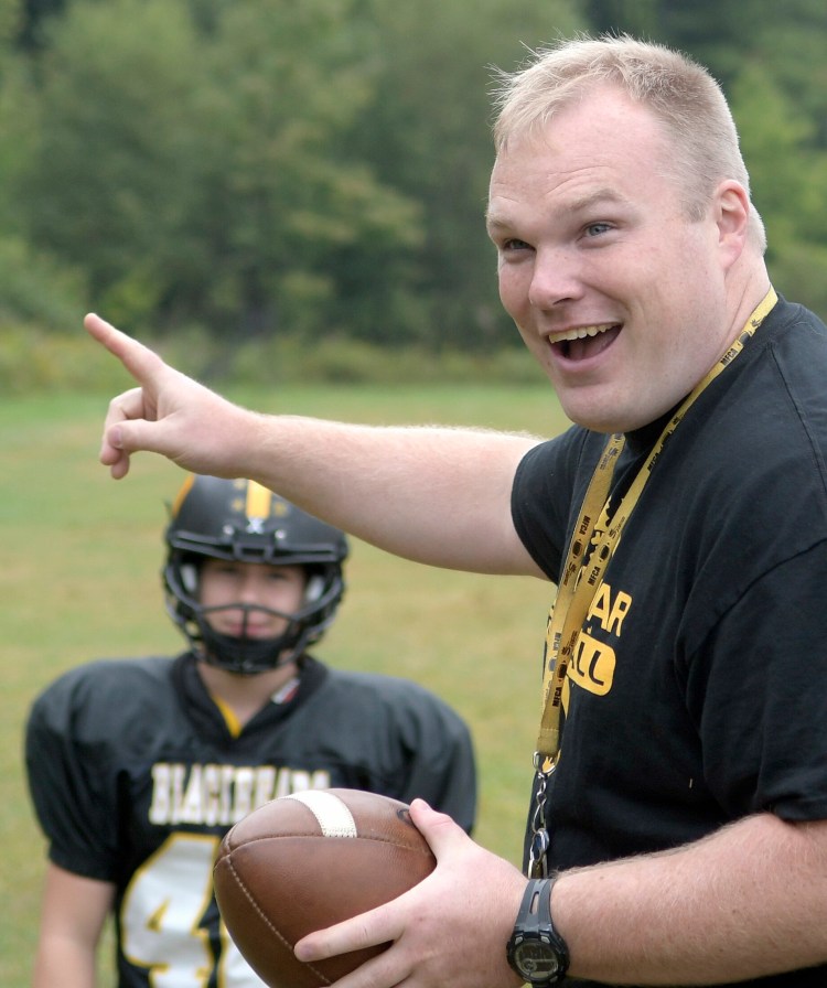 Maranacook football coach Walter Polky enjoys a light moment during a 2017 practice in Readfield. Polky was named the next football coach at Messalonskee High School. 
