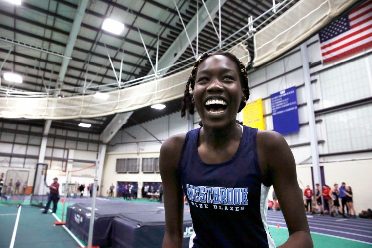 GORHAM, ME - FEBRUARY 9: Westbrook's Nyagoa Bayak smiles after clearing 5'11" during the senior division high jump on Saturday during the SMAA indoor track championships.