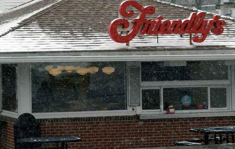 An employee enters Friendly's on Western Avenue in Augusta after the establishment closed for good on Monday.
