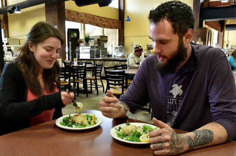 University of Maine at Farmington employee Jane Metsker and friend Richard Dubs said they enjoyed the Maine-caught hake served in the South Dining Hall on Tuesday. The college is making an effort to support Maine producers of food.