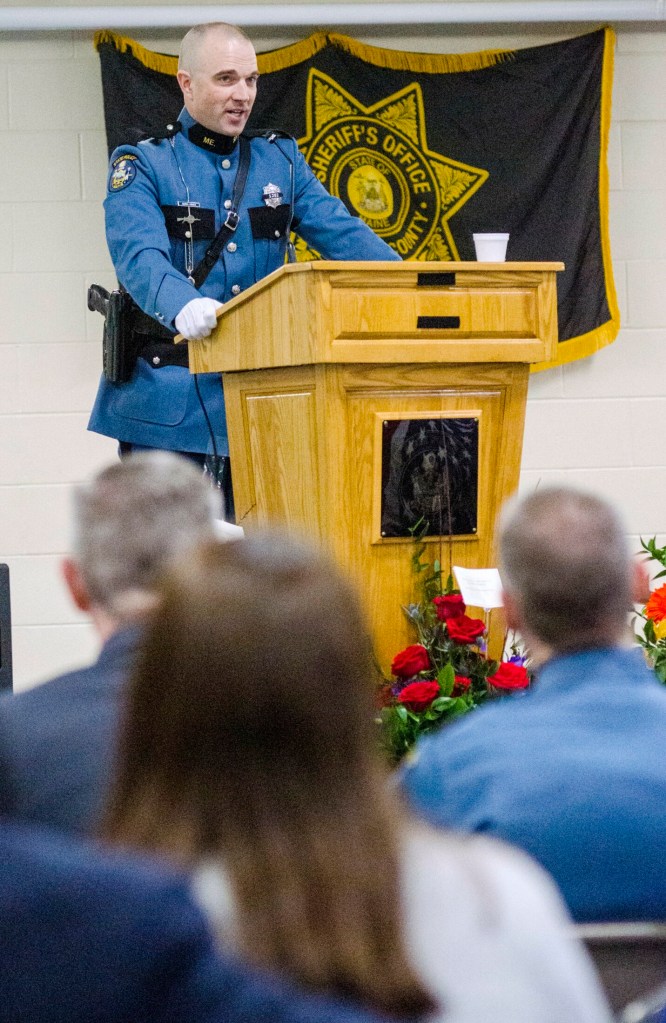 Maine State Police Trooper G.J. Neagle gives a eulogy during Donald Williams' funeral Saturday at the Maine Criminal Justice Academy in Vassalboro. 
