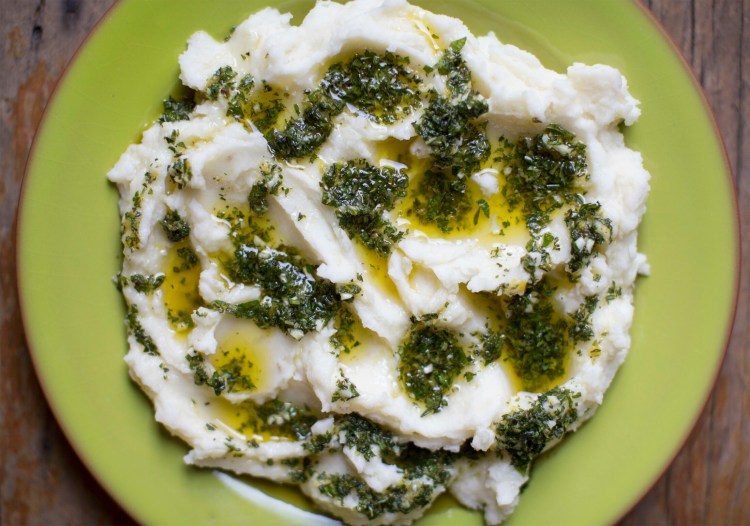 Mashed potatoes with an olive oil - herb topping.