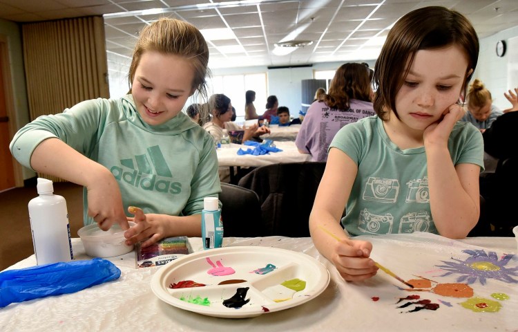 Izabel Hamilton, left, and her sister Charlotte make slime Wednesday during April Fun Camp  at the Skowhegan Community Center.