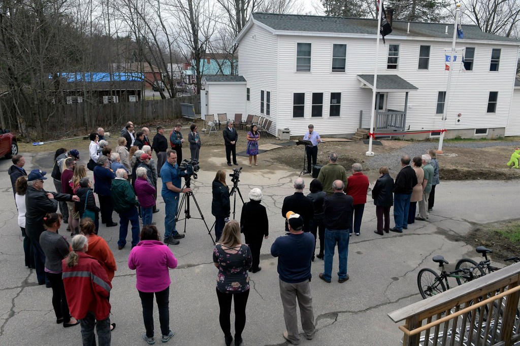 People gather Monday at Bread of Life Ministries in Augusta. The nonprofit hosted a ribbon-cutting ceremony to celebrate adding 14 beds to the existing 26-bed family shelter, as well as the kitchen and additional space at the nearby veterans' shelter, which is the only one of its kind in Maine.