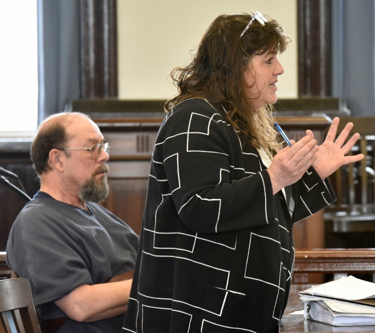 Jay Mercier listens as his attorney, Amy Fairfield, makes a point Monday in Somerset County Superior Court in Skowhegan during the first day of his appeal of his conviction for the murder of Rita St. Peter. 