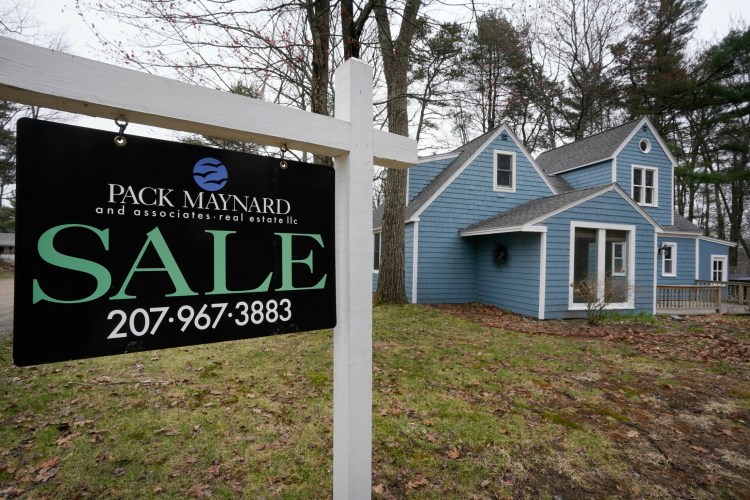A for sale sign stands Monday in the yard of a home on Colby Lane in Kennebunk that has been on the market for 221 days. The number of home sales and the median sale price declined in March, indicating that Maine's upward real estate trend that has lasted nearly three years is over.