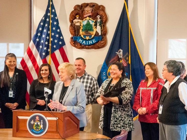 Gov. Janet Mills stands with Maine tribal leaders during April 26's signing ceremony for a bill changing name of the October holiday from Columbus Day to Indigenous Peoples Day in Maine.