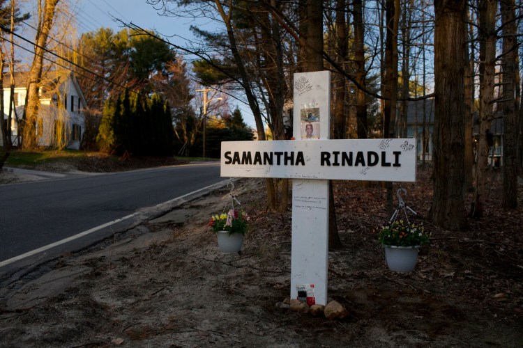 The four children of Samantha Rinaldi of Gray erected a cross in her memory on Yarmouth Road in Gray on April 28.
