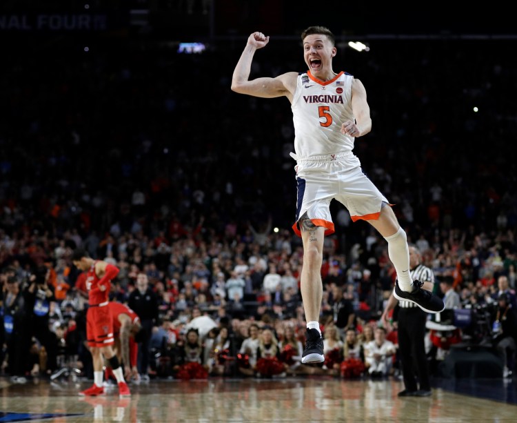 Virginia's Kyle Guy celebrates after the Cavaliers beat Texas Tech 85-77 in the overtime of the NCAA Division I men's basketball game Monday in Minneapolis.