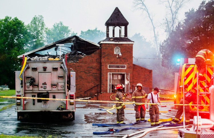  In this April 4, 2019 file photo, firefighters and fire investigators respond to a fire at Mt. Pleasant Baptist Church, in Opelousas, La. Authorities have arrested a person in connection with suspicious fires at three historic black churches in southern Louisiana, a federal prosecutor said. 