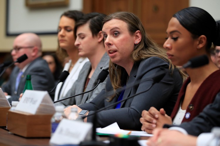 In this Feb. 27, 2019 file photo, Army Staff Sgt. Patricia King, second from right, together with other transgender military members, from left, Navy Lt. Cmdr. Blake Dremann, Army Capt. Alivia Stehlik, Army Capt. Jennifer Peace and Navy Petty Officer Third Class Akira Wyatt, testify about their military service before a House Armed Services Subcommittee on Military Personnel hearing on Capitol Hill in Washington.