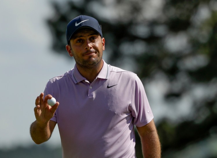 Francesco Molinari acknowledges the crowd after making a birdie Saturday in the third round of the Masters. Molinari shot a 6-under 66 to take a two-stroke lead over Tiger Woods and Tony Finau.