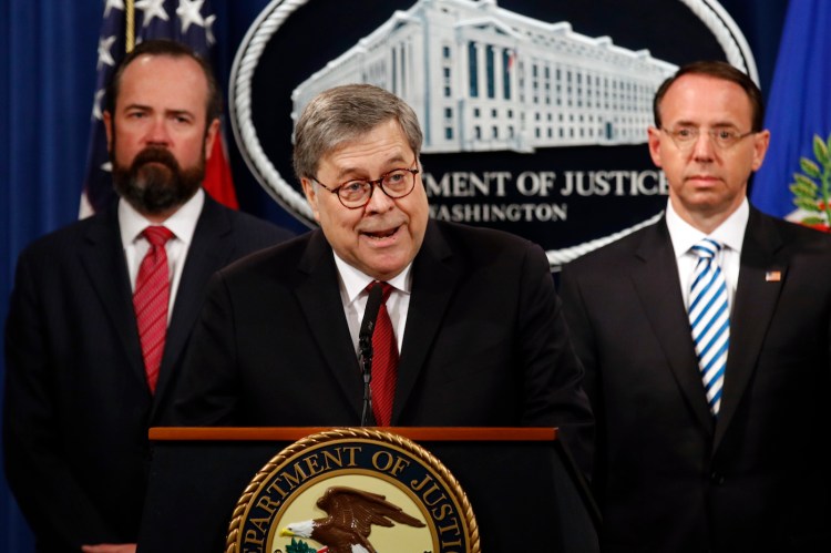 Attorney General William Barr speaks alongside Deputy Attorney General Rod Rosenstein, right, about the release of a redacted version of special counsel Robert Mueller’s report during a news conference on April 18.