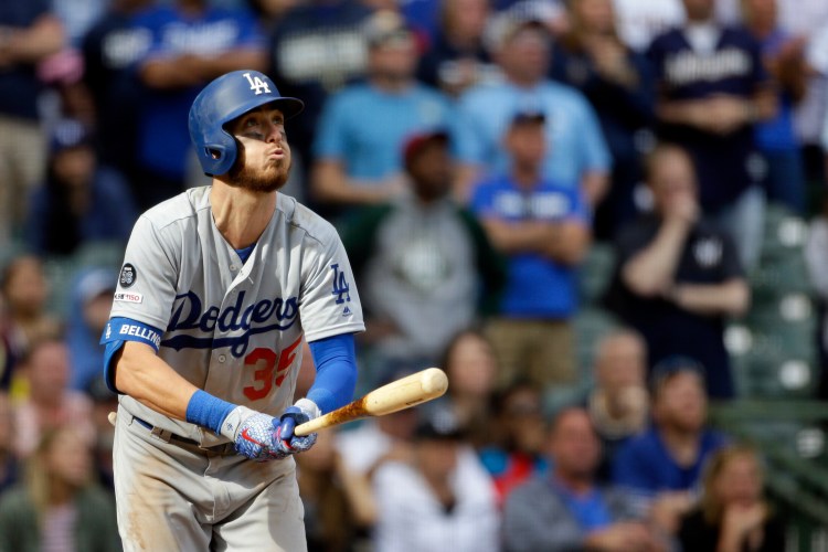 Cody Bellinger of the Los Angeles Dodgers watches the ball leave the park Sunday – a winning home run in the ninth inning of a 6-5 victory against the Milwaukee Brewers.(AP Photo/Aaron Gash)
