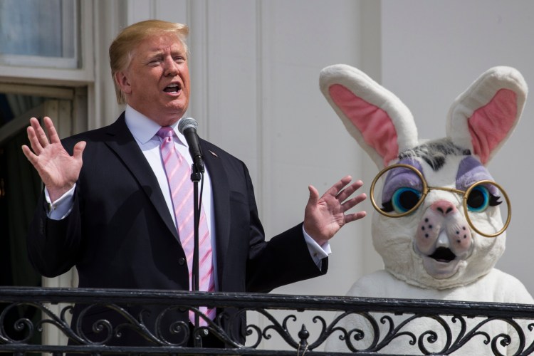 President Donald Trump, joined by the Easter Bunny, speaks from the Truman Balcony of the White House in Washington, Monday, April 22, 2019, during the annual White House Easter Egg Roll. 