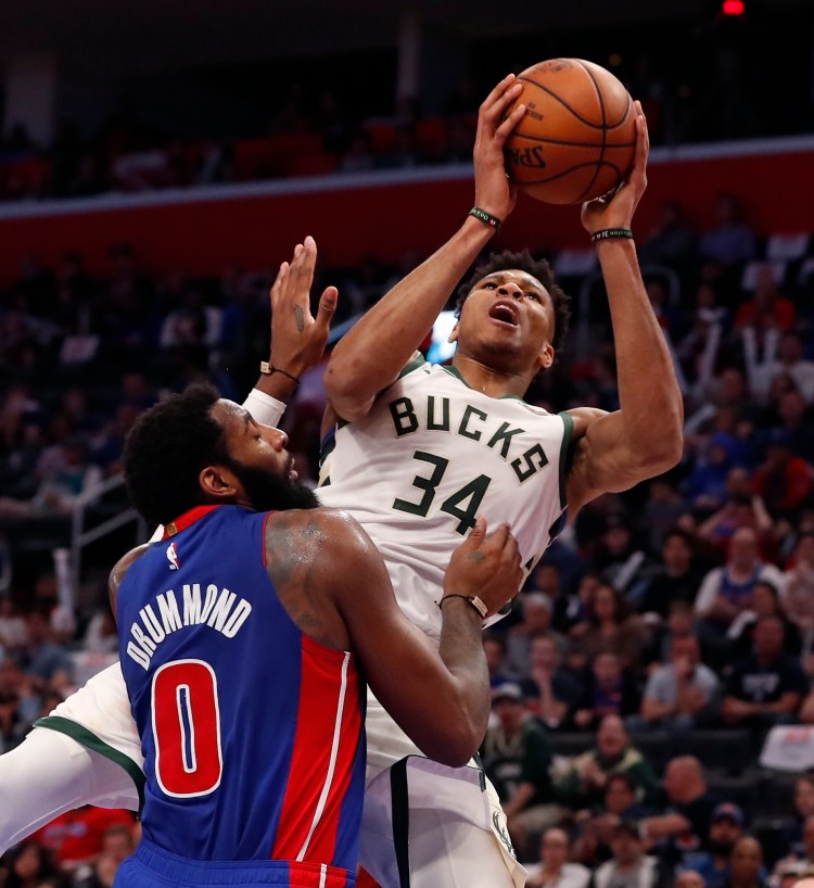 Milwaukee forward Giannis Antetokounmpo is fouled by Detroit center Andre Drummond during the first half of the Bucks' 127-104 win Monday night in Detroit. The Bucks won the series 4-0 and advances to play Boston in the Eastern Conference semifinals.