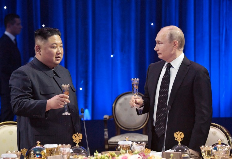 Russian President Vladimir Putin, right, toasts with North Korea's leader Kim Jong Un after their talks in Vladivostok, Russia, Thursday, April 25, 2019. 