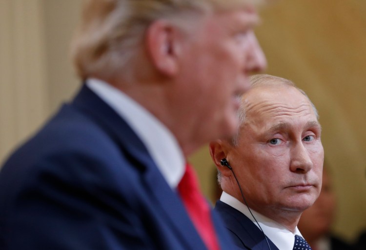 Russian President Vladimir Putin looks toward U.S. President  Trump during their joint news conference at the Presidential Palace in Helsinki, Finland, in 2018.