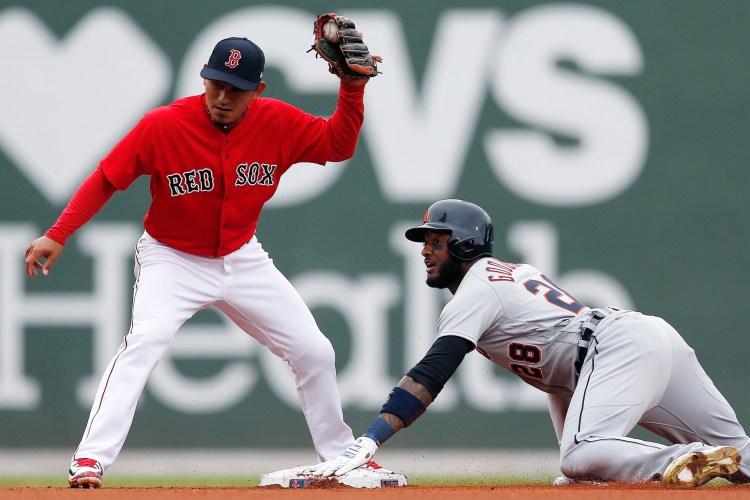 Detroit's Niko Goodrum steals second base while Boston's Tzu-Wei Lin looks for the call on Monday in Boston. The Red Sox lost the first game of the doubleheader, 7-4.