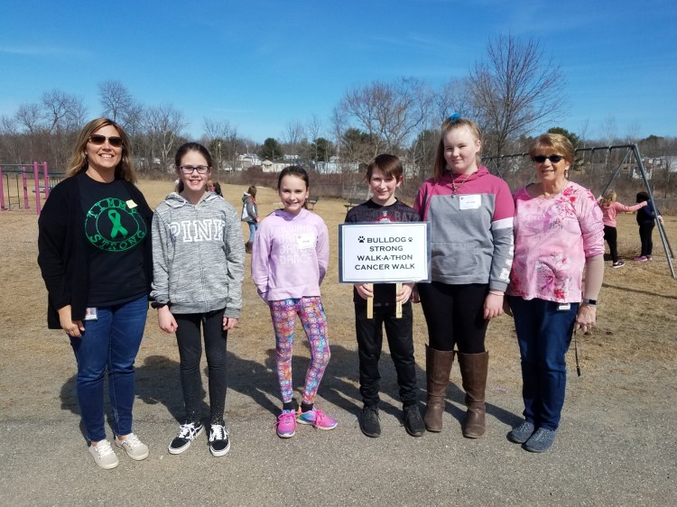 Clinton Elementary School’s Student Council recently led the school in a Bulldog Strong Walk-athon Cancer Walk for the American Cancer Society. Students and staff carried with them lists of names of the people they know or have known who had cancer. More than $1,002 was raised. From left are Kelley Cloutier, co-advisor, with sixth-grade members Kaylie Smith, Kylie Delile, Colton Carter, Alyssa Carter and Marcia Buck, co-advisor.