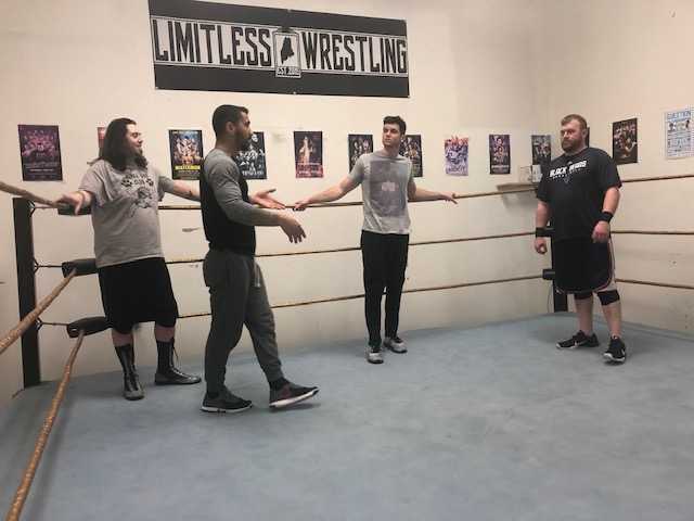 Dave Dyer, far right, listens with other students as Aiden Aggro, long sleeves, gives instruction at the Limitless Dojo in Brewer.