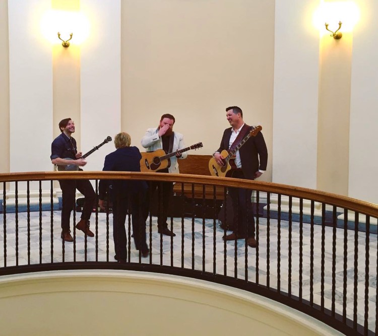 Members of The Ghost of Paul Revere with Gov. Janet Mills (back to camera) April 3 at the State House. The band met with legislators in advance of its song, "The Ballad of the 20th Maine," being proposed as the official state ballad. 