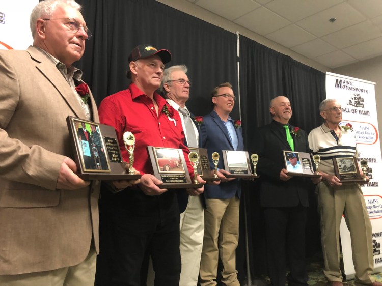 From left to right, Bob Bailey, Dale Chadbourne, Billy Clark, Ricky Craven, Dick Fowler and Lomer Pelletier receive plaques to commemorate their induction into the Maine Motorsports Hall of Fame on Saturday at the Augusta Civic Center in Augusta.