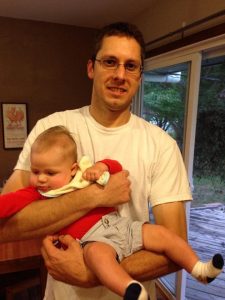 David Dieterich, 35, holds his nephew Henry. Dieterich was on a temporary work assignment in Bath and exploring the city when he stepped onto an unstable dock near the Kennebec Tavern last Thursday and fell into the Kennebec River. 