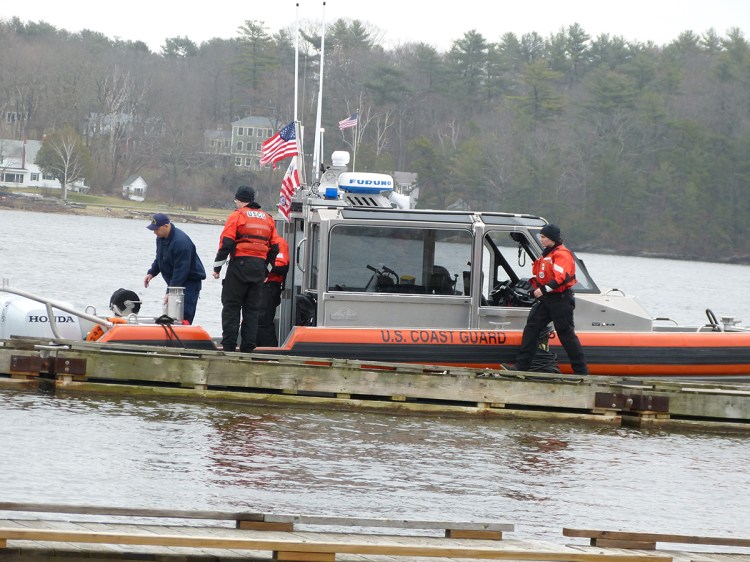 Maine Marine Patrol and U.S. Coast Guard boats and personnel searching the Kennebec River on April 19, the day after David Dieterich slipped and fell into the river.