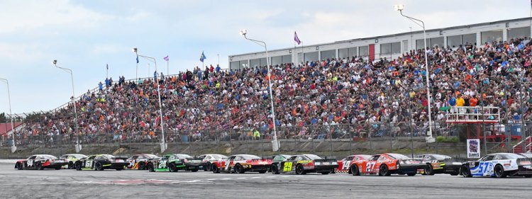 Cars and fans get ready for the start of the Oxford 250 at Oxford Plains Speedway last summer. Car counts aren't as high as they once were, but the quality of the race has not suffered.