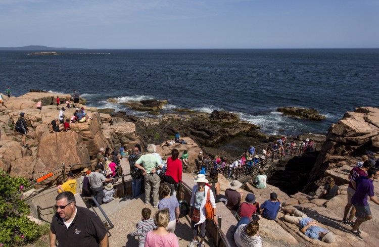 Tourists flock to Thunder Hole at Acadia National Park in June 2016. Maine hosted about 37 million tourists in 2018, a slight increase over the previous year. 