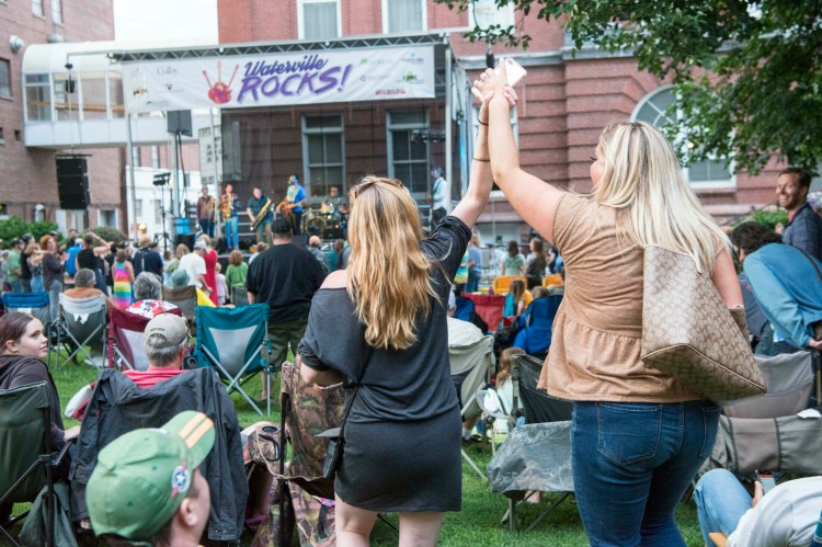 People dance as Rustic Overtones performs for hundreds in attendance to the kick off concert of the Waterville Rocks! concert series for the summer at Castonguay Square in downtown Waterville on July 7, 2018.  
