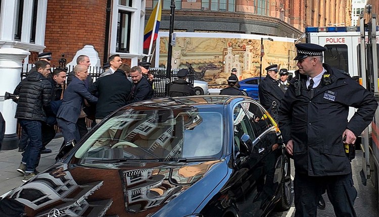 Police carry WikiLeaks founder Julian Assange from the Ecuadorian embassy in London after he was arrested by officers from the Metropolitan Police and taken into custody on Thursday.
