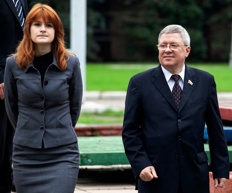 Maria Butina walks with Alexander Torshin then a member of the Russian upper house of parliament in Moscow in 2012.