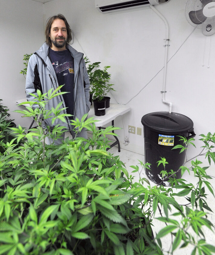 Dawson Julia, a medical marijuana caregiver, stands in a grow room in Unity. While he's glad the state's proposed rules on creating a recreational marijuana market give preference to Maine residents, he said some of the regulations are ambiguous and absurd.