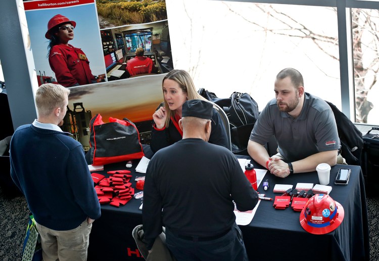 Visitors to the Pittsburgh veterans job fair meet with recruiters at Heinz Field in Pittsburgh in March.