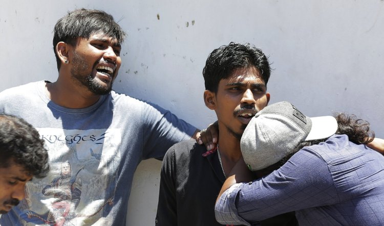 Relatives of people killed in church blasts in Sri Lanka mourn as they wait outside a mortuary in Colombo, Sri Lanka on Sunday. Near-simultaneous blasts rocked three churches and three hotels in Sri Lanka on Easter Sunday.
