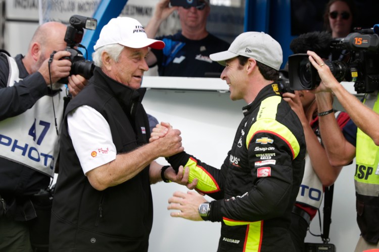 Simon Pagenaud is congratulated by car owner Roger Penske after winning the pole last weekend for today’s Indianapolis 500. Penske’s team has won the event 17 times.