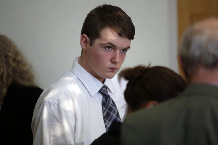 Dominic Sylvester, now 18, confers with lawyers during a recess in his hearing March 21 in West Bath District Court. A judge decided Thursday that the Bowdoinham teenager will be tried as an adult in the death of his grandmother.