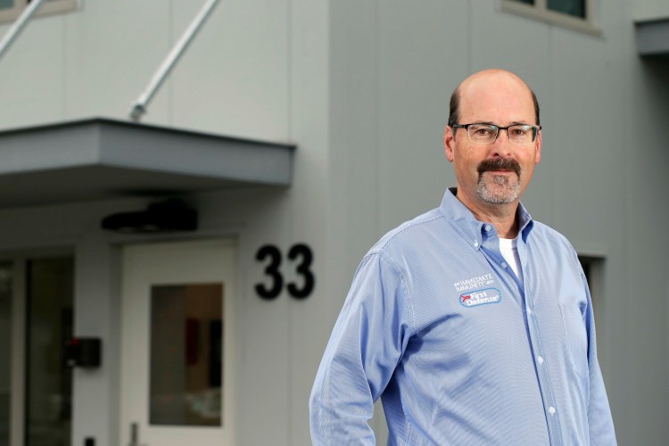 Michael Brigham, president and CEO of ImmuCell, stands outside the company's new building in the Riverside area of Portland. On Tuesday, the company reported strong revenue in its first quarter, attributable to clearing a bottleneck of back orders that had slowed revenues. The company makes bovine medicine for the beef and dairy industries.