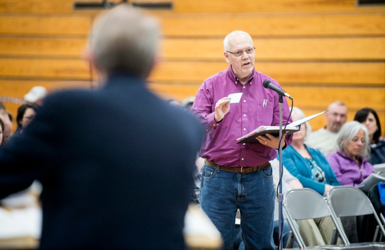 Steve Grenier, a former school board member, discusses budget concerns with the school board May 14 during a SAD 49 school budget meeting at Lawrence Junior High School in Fairfield.