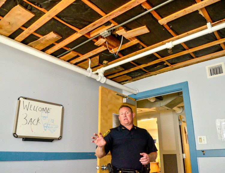 Augusta Police Chief Jared Mills stands in a detective's office, where the ceiling was ripped down after a leak, during a tour of the Augusta Police Station on Aug. 21, 2019, in Augusta. The tour highlighted reasons why the city is exploring constructing a new police station.