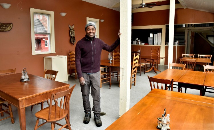 Jordan Benissan, owner of the new Me Lon Togo restaurant, stands in the dining room Thursday of his restaurant on Main Street in Waterville that will feature African dishes.