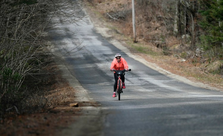 Joan Churchill takes her e-bike out for a spin in Buckfield. The electric assist means she is biking more than ever. 
