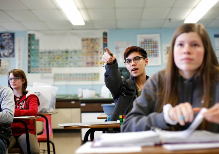 Luis Panuncialman, a freshman from Bangor, poses a question during an organic chemistry class at the Maine School of Science and Mathematics last week. Staff photo by Derek Davis
