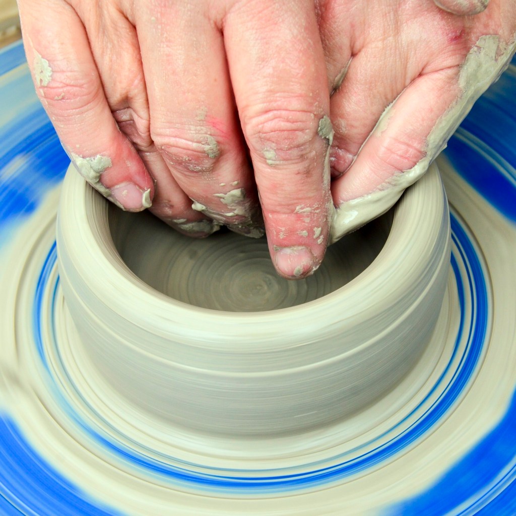 Lori Watts demonstrates throwing a bowl on a wheel during a Maine Pottery Tour event on Saturday at Fine Mess Pottery in Augusta.