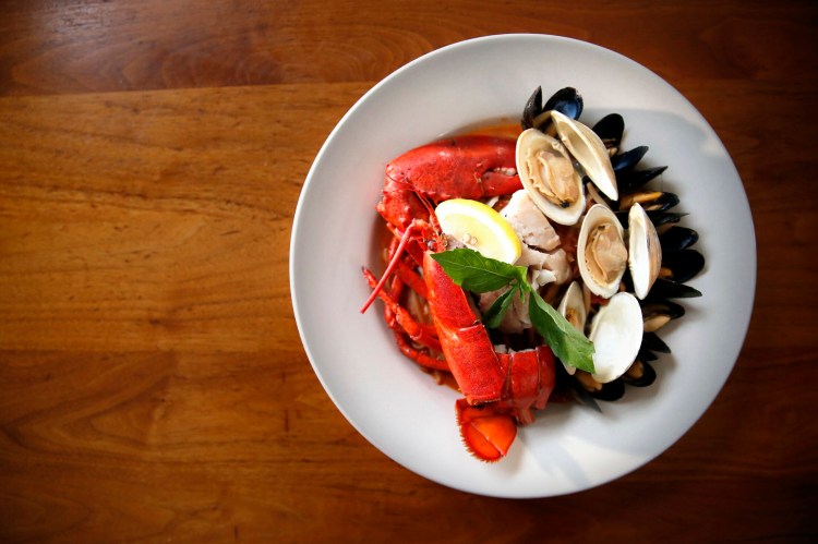 Sicilian-style cioppino –  the house specialty at Azure Cafe – includes half a lobster, countneck clams, pollock and mussels in a spicy tomato broth. It was our reviewer's favorite dish.